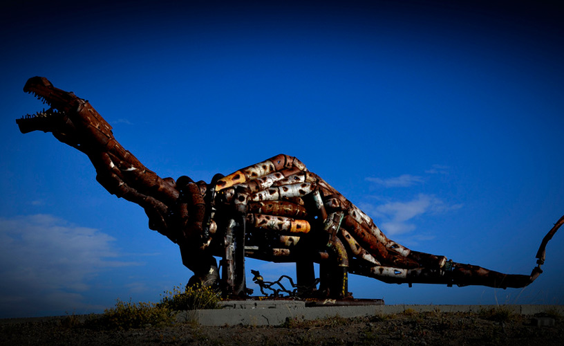 A metal structure representing a dinosaur