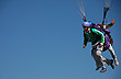Multi-colored paragliders in Loma Bola 
