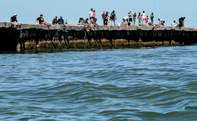 Anglers trying their luck at the jetty