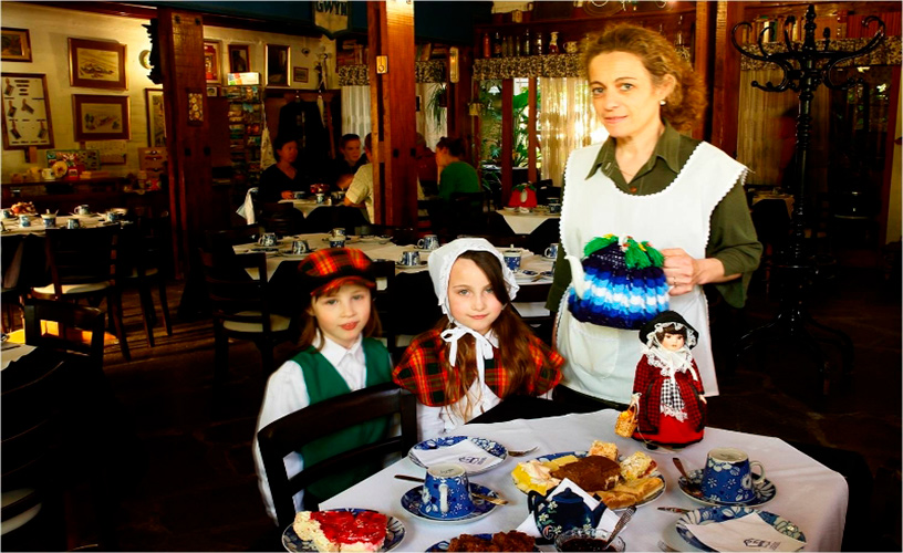 A waitress wearing a white apron