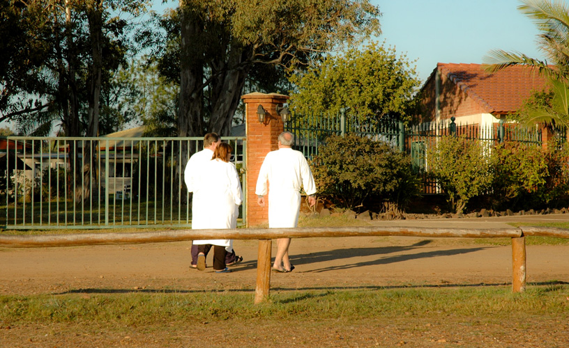 Men and women dressed in white