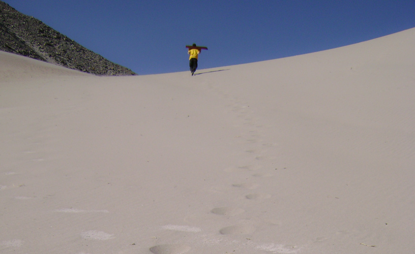 The fine white sand invites
